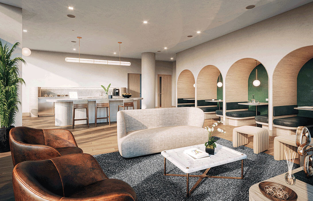 Conference waiting area with grey couch and counter with sink