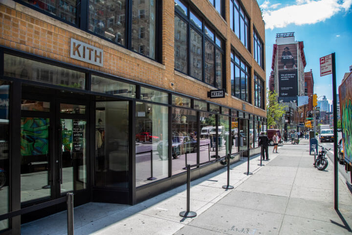 Sidewalk lined with retail stores