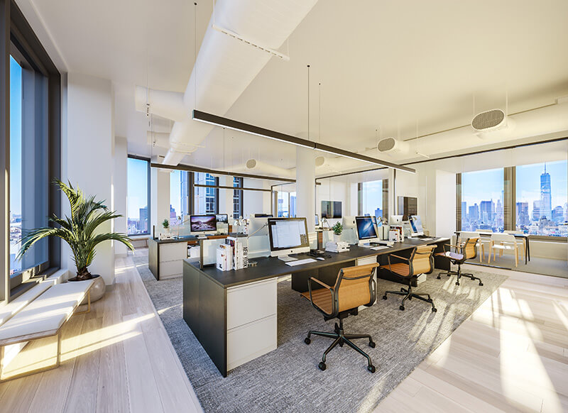 Open concept office area with multiple workstations and city views