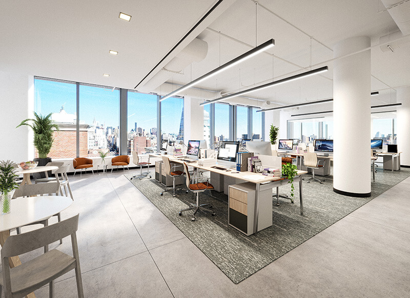 Open concept office with natural light and multiple workstations