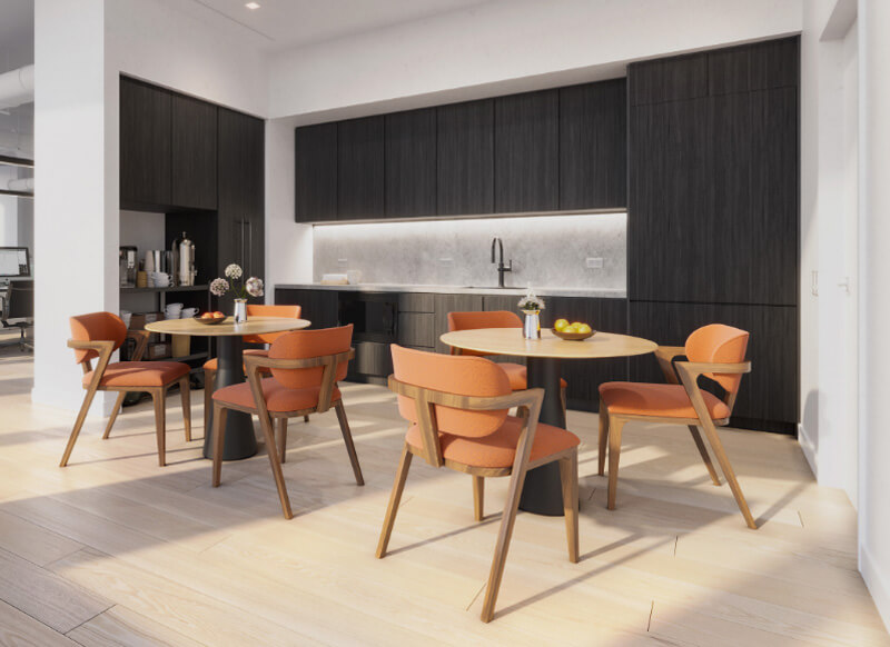 Break room with tables and chairs and coffee bar