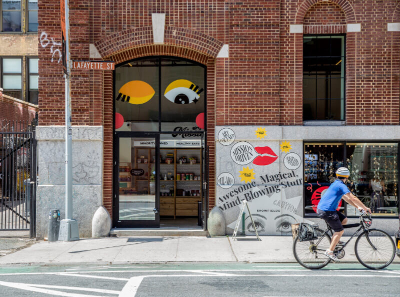 A cyclist goes past Showfields restaurant