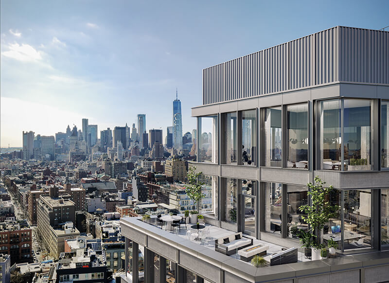Two-story rooftop lounge area overlooking New York City skyline